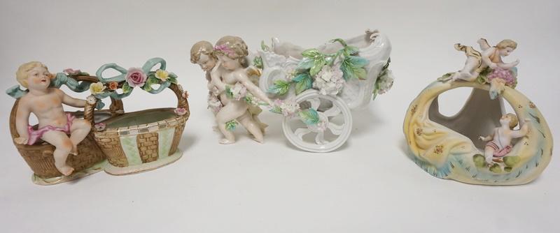 3 PORCELAIN PLANTERS W/CHERUBS: 3 PORCELAIN PLANTERS W/CHERUBS, CART IS 13 IN LONG & HAS A LEAF BROKEN OFF AT THE TOP EDGE