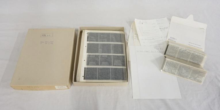 LOT OF OF VICTOR MACAROL PHOTO NEGATIVES: LOT OF VICTOR MACAROL PHOTO NEGATIVES. BOX IS DATED 1985-1986, HAS PAGES OF NEGATIVES IN SLEEVES NUMBERED UP TO 155 ALSO CONTAINS HANDWRITTEN NOTES ON CONTENTS.