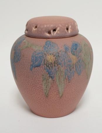 ROOKWOOD/ELIZABETH BARRETT ROSE JAR: ROOKWOOD/ELIZABETH BARRETT ROSE JAR, SCENT JAR, PINK W/BLUE FLOWERS & GREEN LEAVES, HAS BOTH LIDS, SHAPE #1321, PURCHASED PREVIOUSLY AT DENNIS AUCTION ON 3/9/02, RECEIPT INCLUDED, 6 1/8 IN HIGH