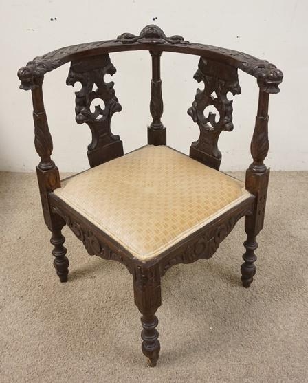 CARVED CORNER CHAIR W/LION HEAD ARMS: CARVED CORNER CHAIR W/LION HEAD ARMS & FACE IN THE CENTER, 18 IN WIDE X 29 1/2 IN HIGH