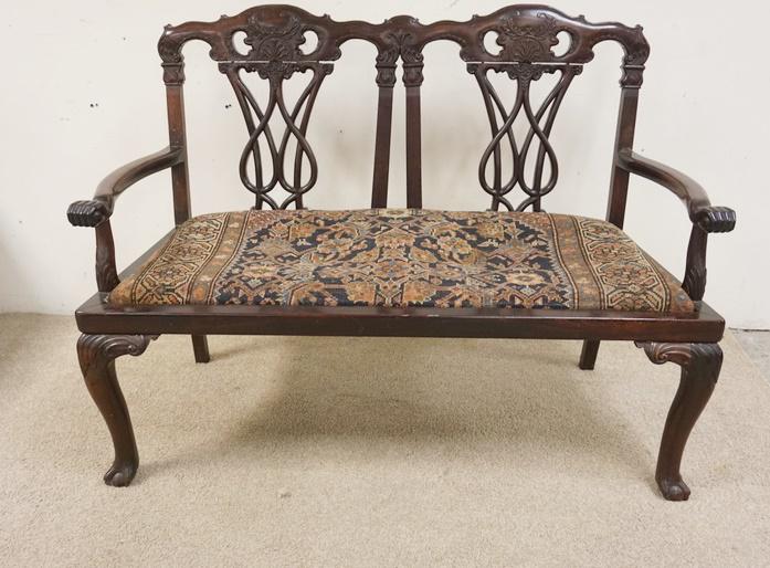 EXCEPTIONAL ROSEWOOD CARVED SETTEE: EXCEPTIONAL ROSEWOOD CARVED SETTEE, HAS HANDS CARVED AT THE END OF THE ARMS, BALL & CLAW FEET, 53 IN WIDE X 39 IN HIGH X 22 IN DEEP