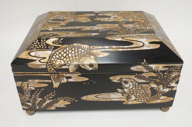 MAITLAND SMITH CARVED BOX W/FISH: MAITLAND SMITH CARVED BOX W/FISH MOTIF, BRASS BALL FEET, BLACK LACQUER W/SILVER & GOLD GILT, 15 IN X 11 1/4 IN X 8 IN HIGH