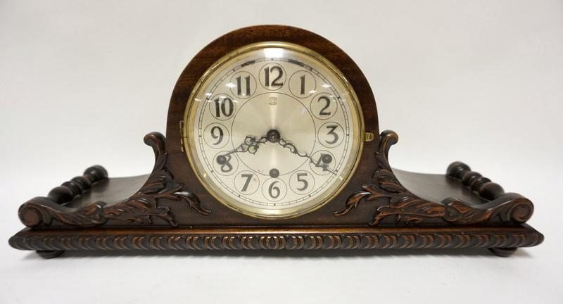HERMAN MILLER CLOCK CO MANTLE CLOCK: HERMAN MILLER CLOCK COMPANY MANTLE CLOCK IN A NICELY CARVED CASE W/WESTMINSTER CHIME, ORIGINAL BRASS LABEL ON THE BACK, 22 IN WIDE X 9 3/4 IN HIGH