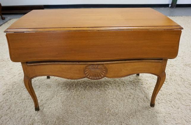 SHELL CARVED DROP LEAF TABLE: SHELL CARVED DROP LEAF TABLE HAS A DRAWER IN THE LOWER SECTION, 21 IN X 35 1/2 IN CLOSED, DROPS ARE 7 1/2 IN. 27 IN H