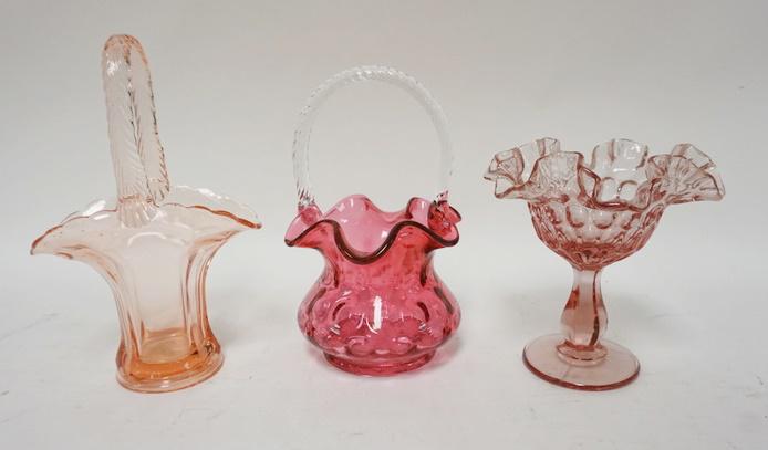3 PIECE GLASS LOT: 3 PIECE GLASS LOT, FENTON COMPOTE, CRANBERRY BASKET W/TWIST HANDLE & PINK BASKET, TALLEST IS 9 IN
