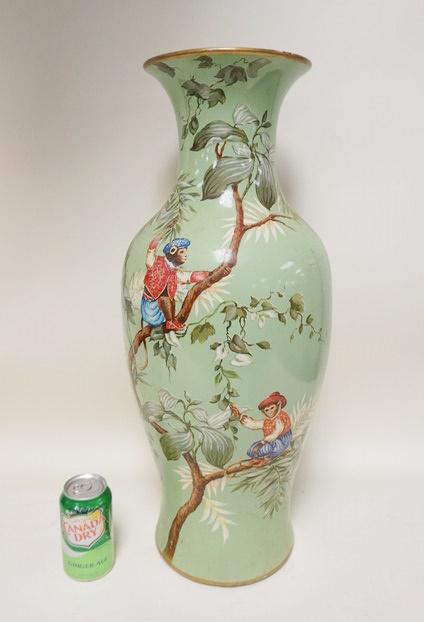 LARGE VASE DECORATED W/MONKEYS: LARGE VASE DECORATED W/MONKEYS WEARING HUMAN CLOTHING, 25 IN HIGH