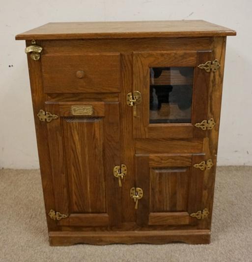 CONTEMPORARY OAK ICE BOX: CONTEMPORARY OAK ICE BOX HAS A WINE RACK SECTION. 3 DOORS ONE GLASS & A DRAWER. 31 IN W 18 IN DEEP 37 3/4 IN HIGH
