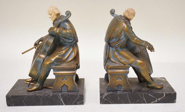 1932 BOOKENDS DEPICTING CELLISTS: 1932 BOOKENDS DEPICTING CELLISTS SIGNED ON MARBLE BASES, 6 1/2 IN HIGH