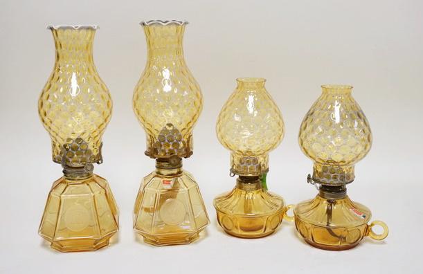 4 AMBER FOSTORIA COIN GLASS OIL LAMPS: 4 AMBER FOSTORIA COIN GLASS OIL LAMPS, TWO ARE CHAMBER LAMPS. TALLEST 14 IN H