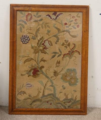 FLORAL EMBROIDERY: FLORAL EMBROIDERY IN A BIRDSEYE MAPLE FRAME, SOME VENEER LOSS AT THE TOP OF THE FRAME, 21 1/4 IN X 30 IN INCLUDING FRAME