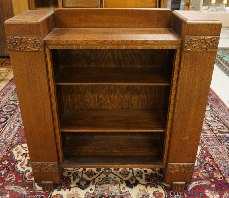 OAK BOOKCASE WITH APPLIED CARVING: OAK BOOKCASE WITH APPLIED CARVING, SIDE SHELVES AND MAGAZINE RACK AT BASE. APPROIMATELY 36 IN X 12 IN X 39 IN