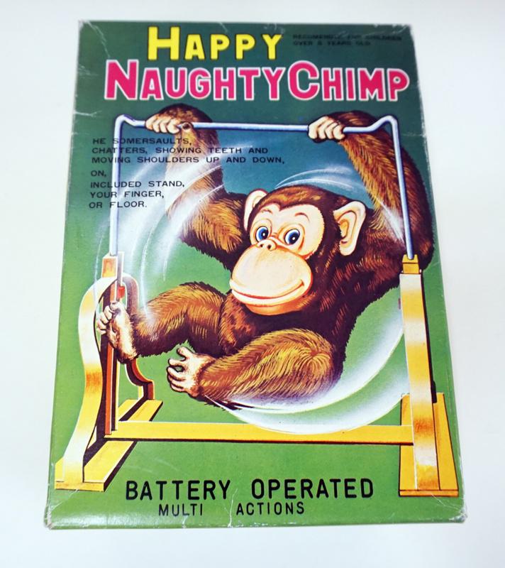 VINTAGE BATTERY OPERATED TOY, JAPAN: VINTAGE BATTERY OPERATED TOY, HAPPY NAUGHTY CHIMP, JAPAN, APPROXIMATELY 7 IN HIGH