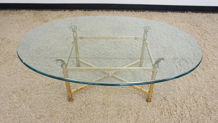 OVAL BRASS COFFEE TABLE: OVAL BRASS COFFEE TABLE W/GLASS TOP, APPROXIMATELY 46 IN X 20 IN X 16 IN HIGH