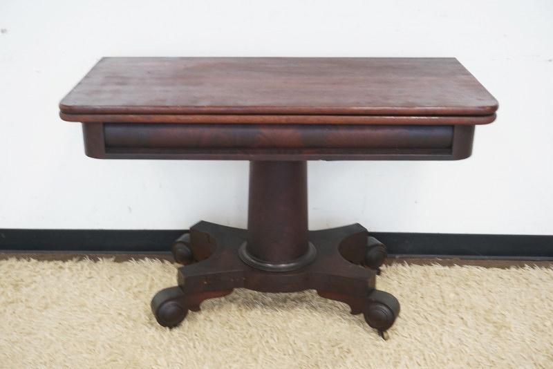 ANTIQUE MAHOGANY EMPIRE FLIP TOP GAME TABLE: ANTIQUE MAHOGANY EMPIRE FLIP TOP GAME TABLE, APPROXIMATELY 45 IN X 22 IN X 31 IN HIGH