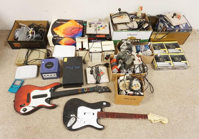 LARGE LOT OF GAMING CONTROLLERS & CONSOLES: LARGE LOT OF GAMING CONTROLLERS & CONSOLES INCLUDING NINTENDO WII, GAMEBOY COLOR, NES, ADVANTAGE, SUPER NINTENDO, PLAY STATION, PLAY STATION 2, GAMECUBE, DUAL SHOCK, ETC