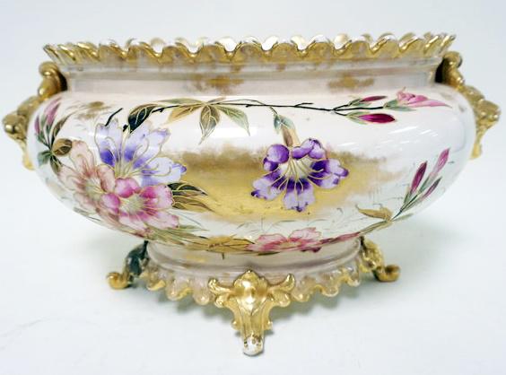ANTIQUE ROYAL BONN OVAL BOWL: ANTIQUE ROYAL BONN OVAL FOOTED BOWL WITH GILT LION HEAD HANDLES, APPROXIMATELY 16 IN X 11 IN X 9 IN HIGH, DISCOLORED INTERIOR