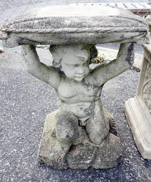 CONCRETE GARDEN SEAT: CONCRETE GARDEN SEAT, FIGURE OF MAN HOLDING PILLOW, ETC. APPROXIMATELY 12 IN X 21 IN HIGH