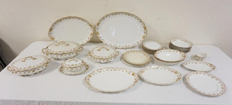 29 PIECES LIMOGES CHINA: 29 PIECES LIMOGES CHINA DECORATED W/A FLORAL BORDER & GILT TRIM, SOME WEAR TO TRIM