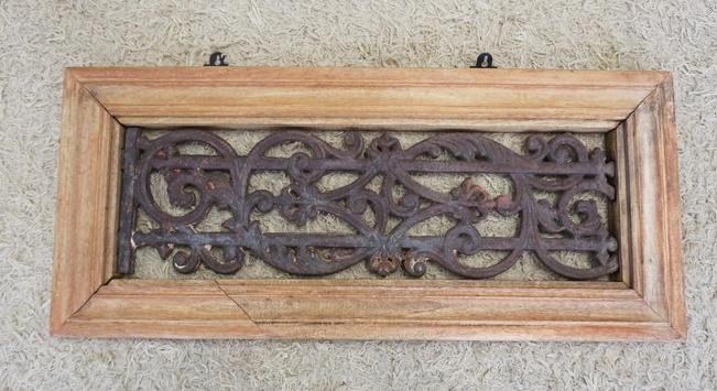 ANTIQUE ORNATE CAST IRON ARCHITECHURAL PIECE: ANTIQUE ORNATE CAST IRON ARCHITECHURAL PIECE IN WOOD FRAME, APPROXIMATELY 16 IN X 35 IN