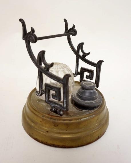 ANTIQUE INKWELL & PEN HOLDER: ANTIQUE INKWELL & PEN HOLDER DATED 1861 W/UNUSUAL PATTERNED INK RESERVOIR, APPROXIMATELY 6 IN HIGH