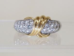 PLATINUM & 18K GOLD RING: PLATINUM & 18K YELLOW GOLD RING CONTAINING 22 ROUND DIAMONDS WEIGHING APP. 0.75 CARATS. TOTAL WEIGHT OF RING 8.25 DWT. RING SIZE APP. 10