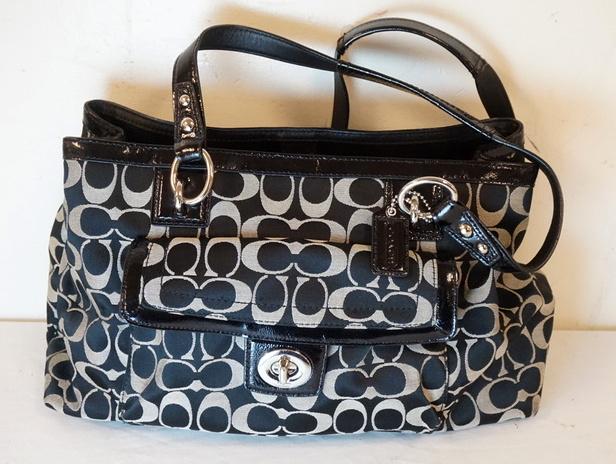 COACH BLACK SIGNATURE BAG: COACH BLACK SIGNATURE BAG, APPROXIMATELY 14 IN L X 8 1/2 IN H X 3 1/2 IN
