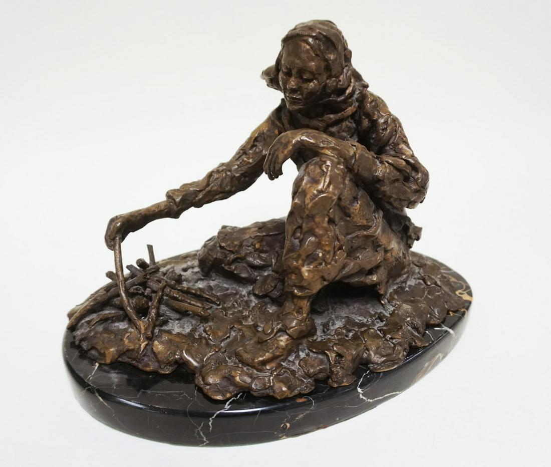 BRONZE SCULPTURE OF MAN: BRONZE SCULPTURE OF MAN CROUCHED, BULLDOG & A FIRE ON MARLBE SLAG, ARTIST SIGNED, APPROXIMATELY 8 1/2 IN X 13 IN X 9 IN HIGH