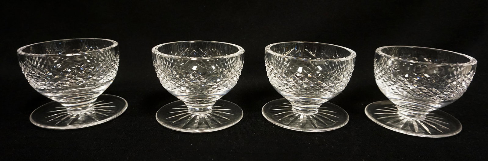 WATERFORD LEAD CRYSTAL 4 FOOTED SHERBERTS: WATERFORD LEAD CRYSTAL 4 PIECE LOT, FOOTED SHERBERTS, APPROXIMATELY 4 IN X 3 1/4 IN HIGH
