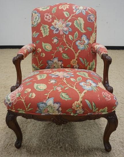 FRENCH PROVINCIAL UPHOLSTERED ARM CHAIR: FRENCH PROVINCIAL UPHOLSTERED ARM CHAIR WITH FORAL UPHOLSTERY AND CARVED FRAME