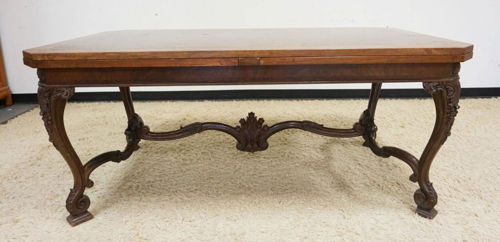 ANTIQUE WALNUT DINING TABLE: ANTIQUE WALNUT DINING TABLE W/PULL OUT EXTENSIONS, CARVED LEGS & STRETCHER, DIAMOND VENEER TOP, APPROXIMATELY OPEN 130 IN, CLOSED 70 IN X 40 IN X 30 IN HIGH