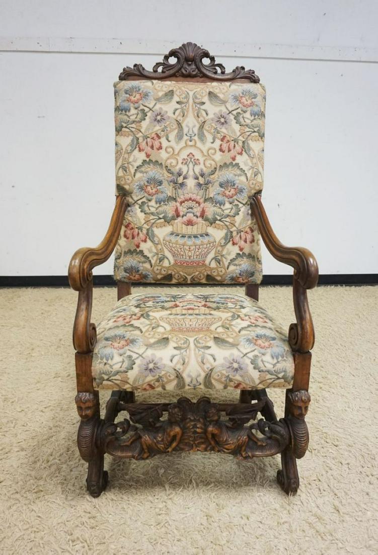 ANTIQUE CONTINENTAL HEAVY CARVED ARMCHAIR: ANTIQUE CONTINENTAL HEAVY CARVED ARMCHAIR W/NEEDLEPOINT UPHOLSTERY & CARVING THROUGHOUT, APPROXIMATELY 57 IN HIGH
