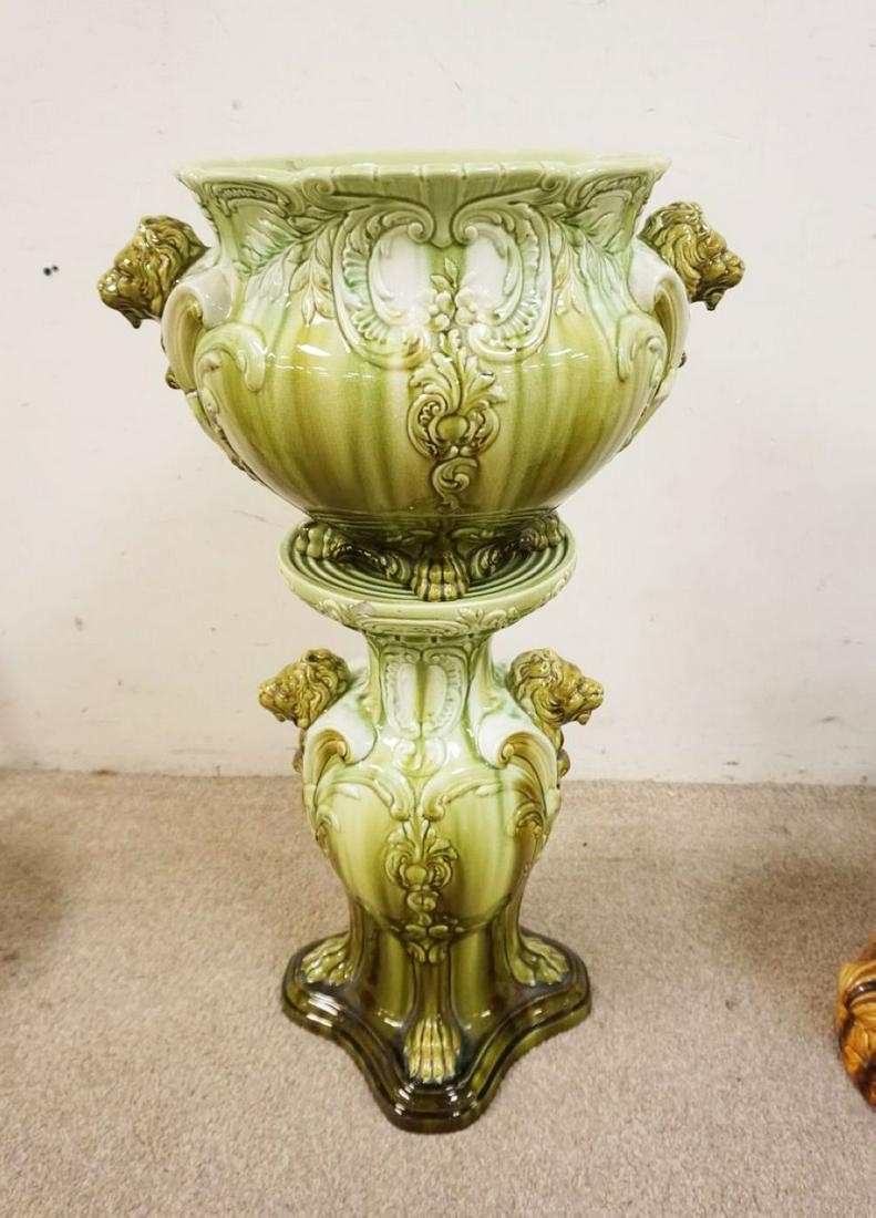 LARGE ROSEVILLE MAJOLICA POT & PEDESTAL: LARGE ROSEVILLE MAJOLICA POT & PEDESTAL W/EMBOSSED LION HEADS & PAWS, LOSS TO CHIN ON ONE, BOTTOM MARKED 44-15 & 815-15, APPROXIMATELY 20 IN X 14 IN X 33 IN HIGH
