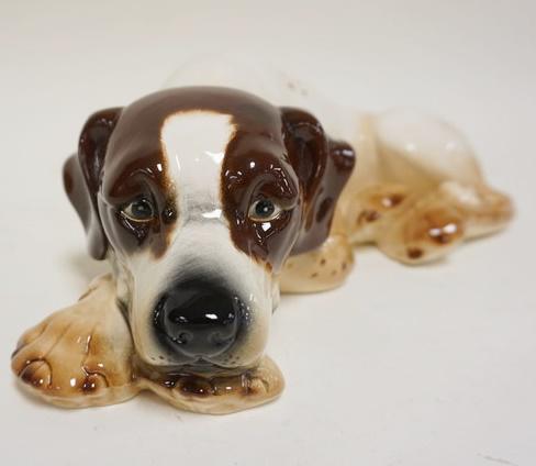 GOEBEL LAYING DOWN DOG FIGURINE: GOEBEL LAYING DOWN DOG FIGURINE APPROXIMATELY 13 IN X 4 IN H