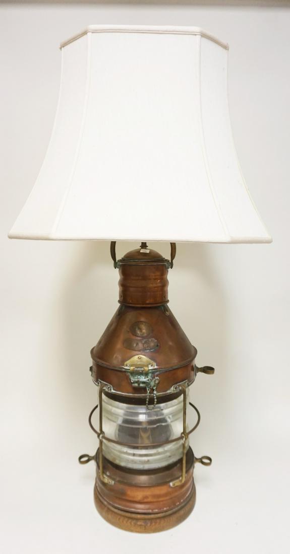 LARGE BRASS & COPPER NAUTICAL SHIPS LANTERN: LARGE BRASS & COPPER NAUTICAL MARITIME SHIPS LANTERN W/TAGS STAMPED *ANCHOR E BAKER & CO MAKERS*, HAS BEEN ELECTRIFIED, HAS LENS CHIPS, APPROXIMATELY 41 IN HIGH OVERALL
