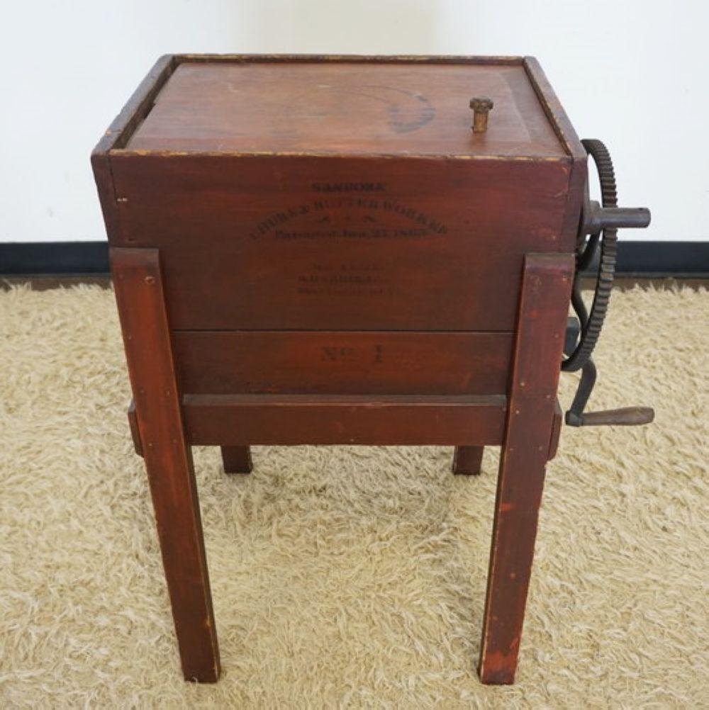ANTIQUE BUTTER CHURN: ANTIQUE BUTTER CHURN IN OLD RED FINISH, MARKED SANBORN CHURN & BUTTER WORKER NO. 1 1865 WEST TOWNSEND VA, MISSING PADDLES. APPROXIMATELY 20 IN X 15 IN X 31 IN HIGH