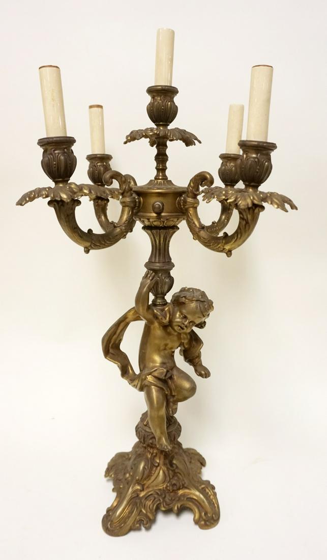 CAST METAL CHERUB CANDELABRA LAMP: CAST METAL CHERUB CANDELABRA LAMP, APPROXIMATELY 24 IN HIGH