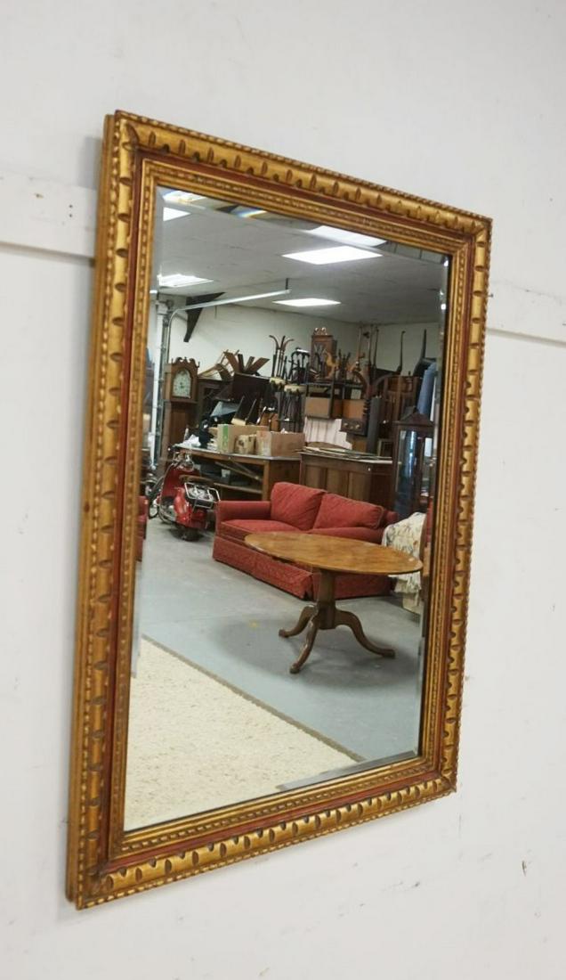 BEVELED EDGE MIRROR IN GILT FRAME: BEVELED EDGE MIRROR IN GILT FRAME, APPROXIMATELY 30 IN X 42 IN