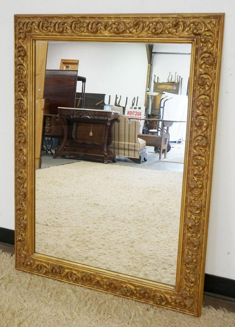 WALL MIRROR IN ORNATE GILT FINISHED FRAME: WALL MIRROR IN ORNATE GILT FINISHED FRAME, APPROXIMATELY 36 IN X 48 IN