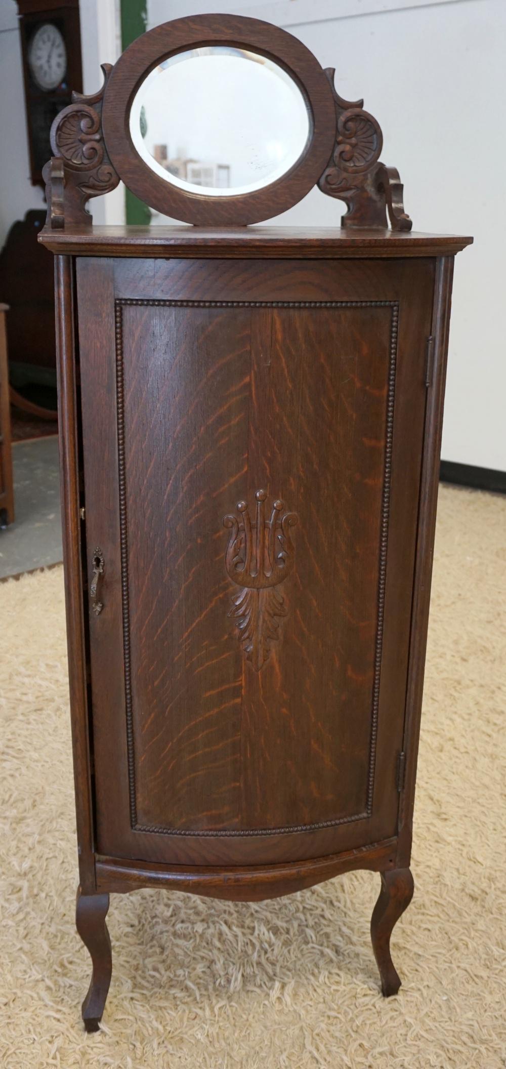 VICTORIAN OAK BOW FRONT MUSIC CABINET: VICTORIAN OAK BOW FRONT MUSIC CABINET, APPROXIMATELY 19 IN X 17 IN X 52 IN HIGH