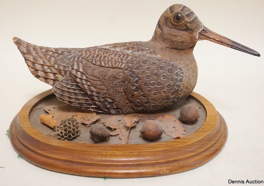 CARVED BIRD W/GLASS EYES: CARVED BIRD W/GLASS EYES & PAINT ACCENTED FEATHERS ON WOOD BASE, APPROXIMATELY 9 IN X 8 IN X 6 IN HIGH