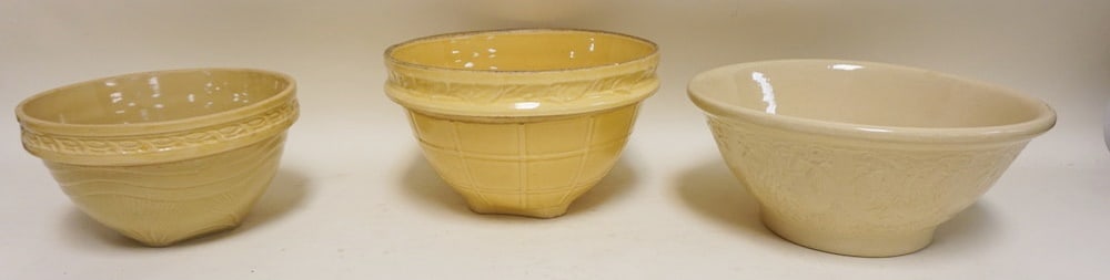 LOT OF 3 EMBOSSED YELLOWARE MIXING BOWLS: LOT OF 3 EMBOSSED YELLOWARE MIXING BOWLS, LARGEST APPROXIMATELY 10 IN X 6 IN HIGH