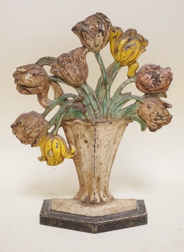 CAST IRON TULIPS IN BASKET DOOR STOP: CAST IRON TULIPS IN BASKET DOOR STOP, APPROXIMATELY 10 IN HIGH