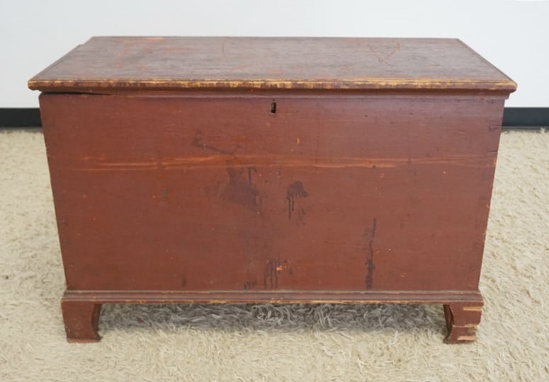 DOVETAILED BLANKET BOX: DOVETAILED BLANKET BOX IN RED FINISH, LOCK LIFTED OUT & LOSS TO FEET, APPROXIMATELY 17 1/2 IN X 37 IN X 25 IN HIGH