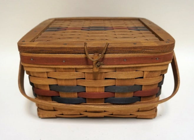 1988 EARLY PIE TRI COLORED BASKET: 1988 EARLY PIE BASKET WITH WOVEN LID, RED AND BLUE WEAVING, RISER. STAINING ON BOTTOM, APPROXIMATELY 12 IN X 12 IN X 7 IN H