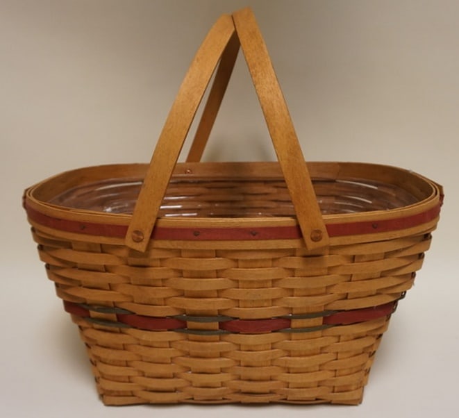 1992 HOSTESS HOLIDAY BASKET: 1992 EARLY HOSTESS HOLIDAY BASKET WITH PROTECTOR, BASKET IS WORN, AND STAINED ON BOTTOM AND BASE, APPROXIMATELY 15 IN X 20 1/2 IN X 10 IN