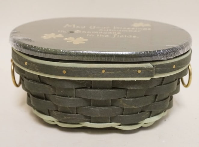 2011 FIELDS OF CLOVER BASKET: 2011 FIELDS OF CLOVER BASKET WITH LINER, PROTECTOR AND LID. APPROXIMATELY 5 1/2 IN X 7 IN X 3 IN H, NEW