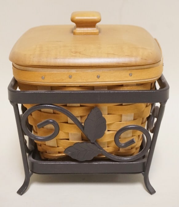 2005 SEEDLING BASKET WITH WROUGHT IRON STAND: 2005 SEEDLING BASKET WITH LINER, PROTECTOR, LID AND WROUGHT IRON HOLDER. HOLDER APPROXIMATELY 6 IN SQ X 4 1/2 IN H. LINER HAS STAINING