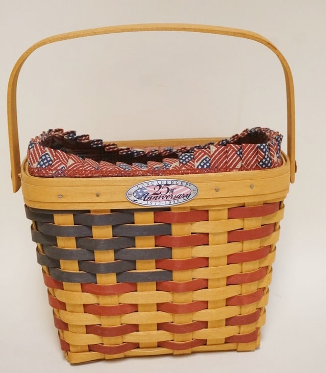 1997 25 ANNIVERSARY FLAG BASKET ': 1997 25TH ANNIVERSARY FLAG BASKET WITH LINER AND PROTECTOR, LINER WORN. APPROXIMATELY 5 IN X 9 IN X 6 3/4 IN