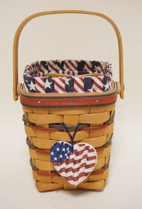 1995 ALL AMERICAN CARRY ALONG BASKET: 1995 ALL AMERICAN CARRY ALONG BASKET WITH LINER, PROTECTOR, HANG TIE AND WOODEN DIVIDER. APPROXIMATELY 5 1/2 SQ X 6 1/4 IN H