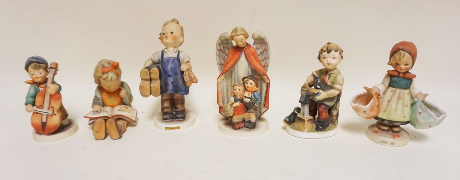 GROUP OF ASSORTED HUMMEL FIGURINES: GROUP OF ASSORTED HUMMEL FIGURINES, TALLEST APPROXIMATELY 7 1/2 IN